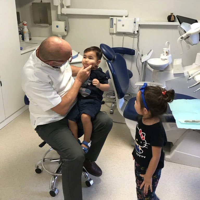 Dr. Can Tokman is with a kid patient